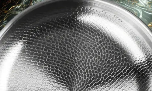 Crispy salmon searing on hammered titanium surface